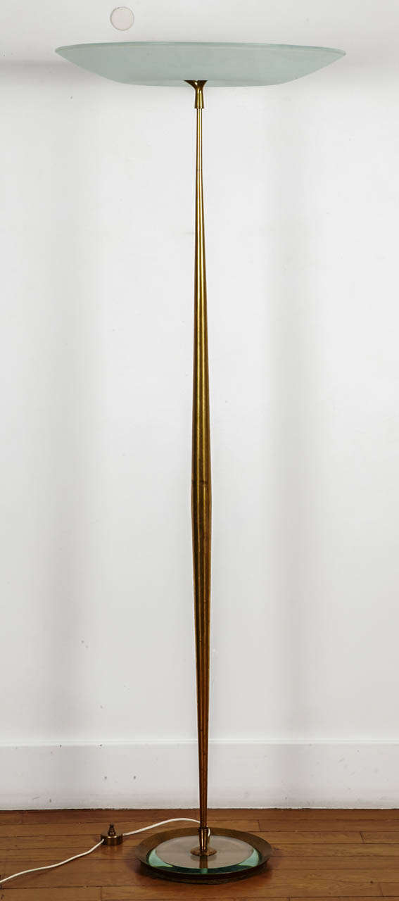 Rare and elegant glass and bronze floor lamp, by Max Ingrand (1908-1969) for Fontana Arte, circa 1957. 
Gilt bronze shaft pointing with three fingers under the frosted glass vasque, circular clear bevelled glass and brass base (diam.29 cm). 
Ref :
