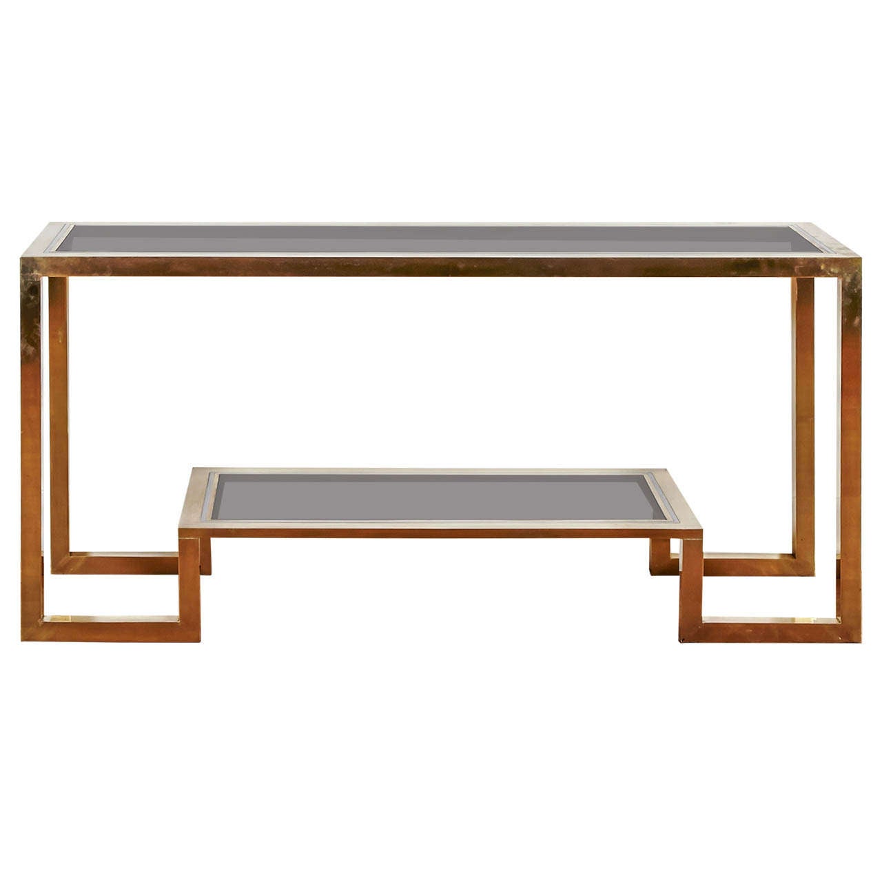 Important gilt brass and chromed steel console table, by Romeo Rega, Italy, 1970s.
Two smoked glass tops. Asymetrical Under shelf.