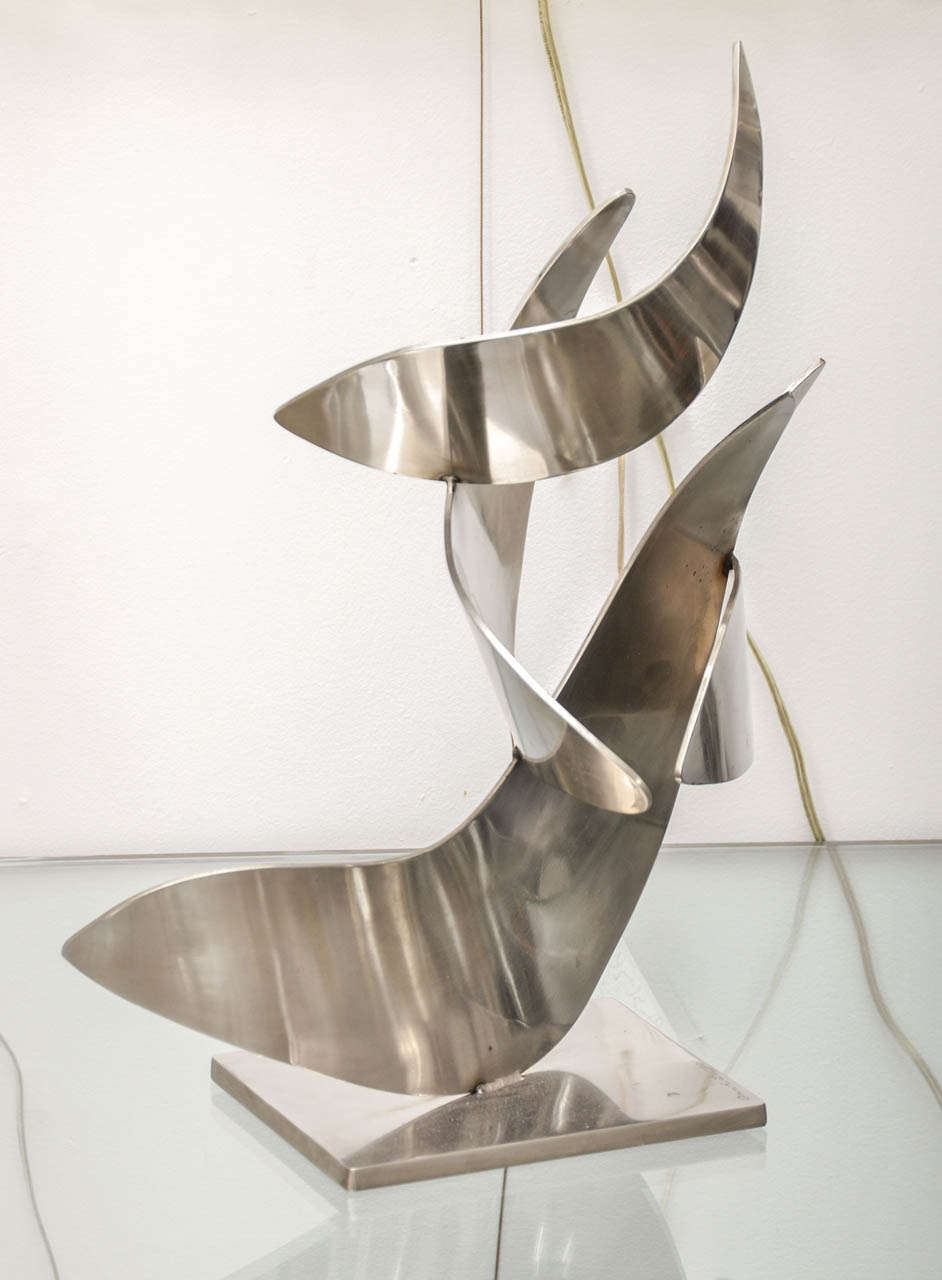 Free form polished stainless steel sculpture, signed by Ann C. Lange.