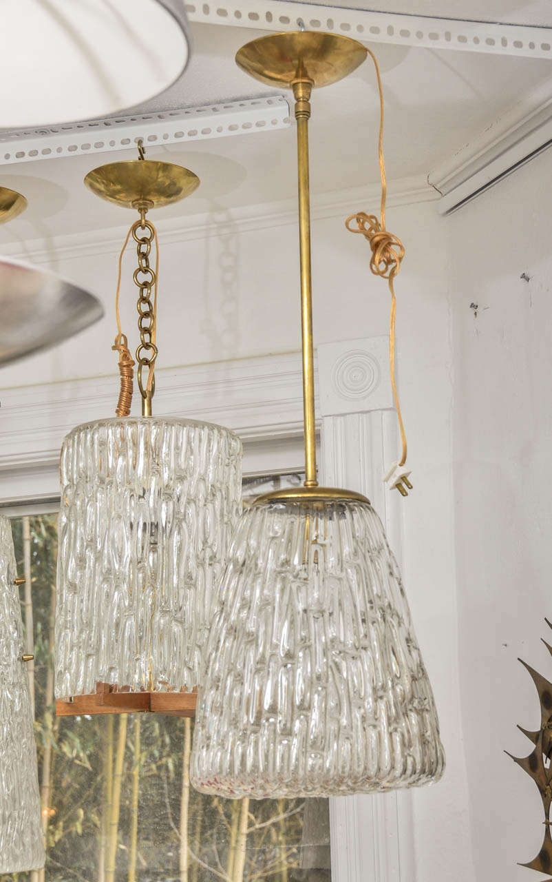 Sculptural Kalmar glass and brass pendant with closed bottom. Glass fixture height alone is 12