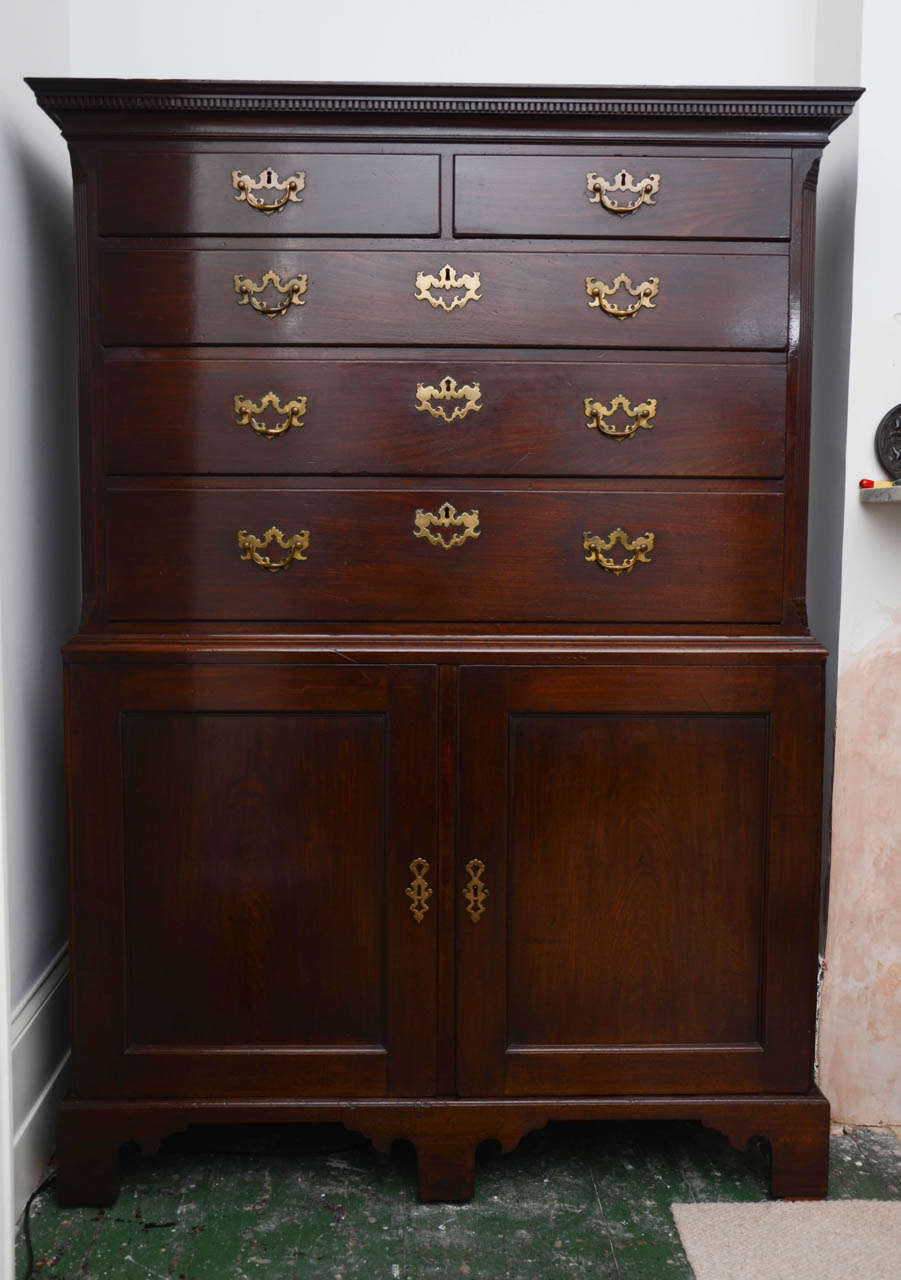 An absolutely super example of mid 18th century design and cabinetmaking.  The dentilled cornice crowns the top section of drawers with wonderful Chinese Rococo mounts, framed by moulded add fluted chamfered corners.  The lower section comprises a
