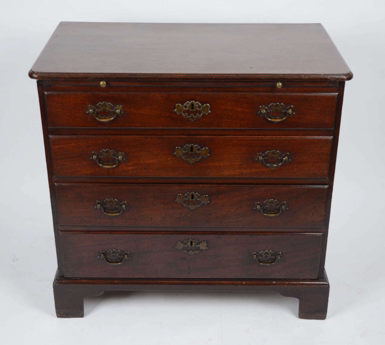 This is is the ultimate early George II period gem of mahogany cabinetmaking, sitting there now as a stylish, rich, mellow, and of course very useful piece of furniture.  Ones eyes are drawn by the sophisticated details; from the re-entrant  corners