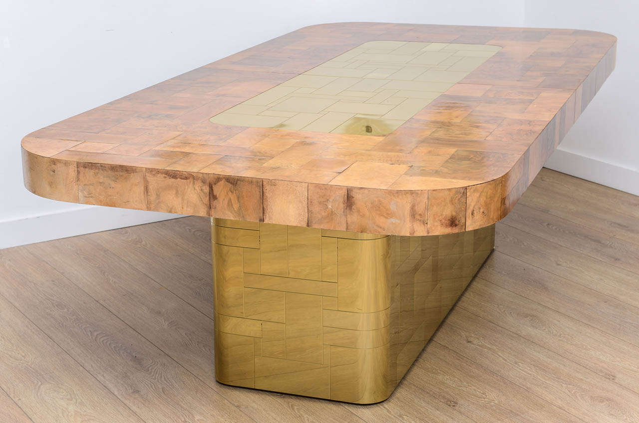 A large Cityscape line extension dining or conference table in burl walnut and brass  by Paul Evans for Directional.
Table opens and extend for two extension leaves to 126