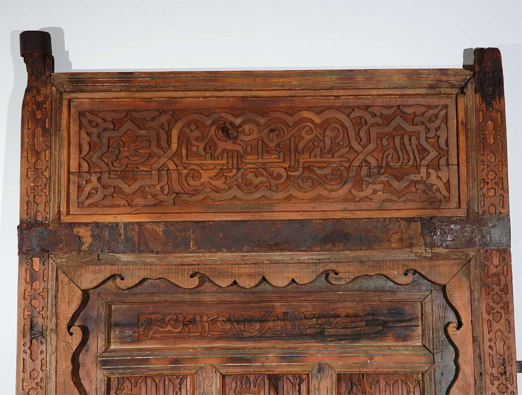 Antique 19th century handcrafted Hispano Moresque door.
Intricately hand-carved in Moorish style with Islamic Arabic calligraphy writing.
Moroccan door frame in wood and iron, handmade in Morocco.
Doris Duke at Shangri La in Hawai used this kind