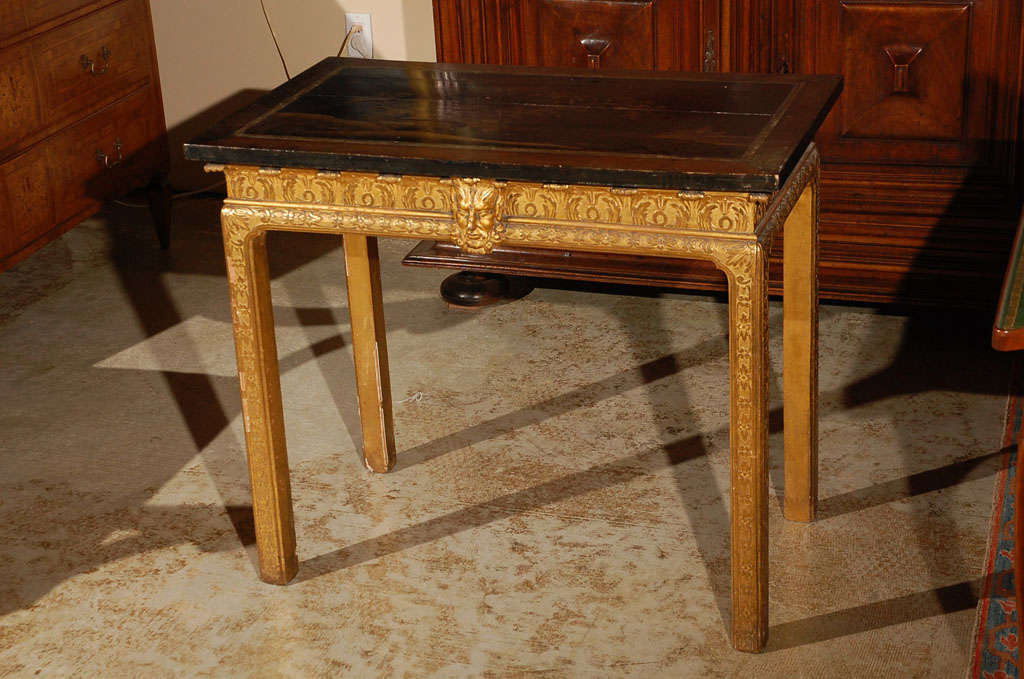Hand-carved, hand-gilded, George V table with gilded legs and chinoiserie top.