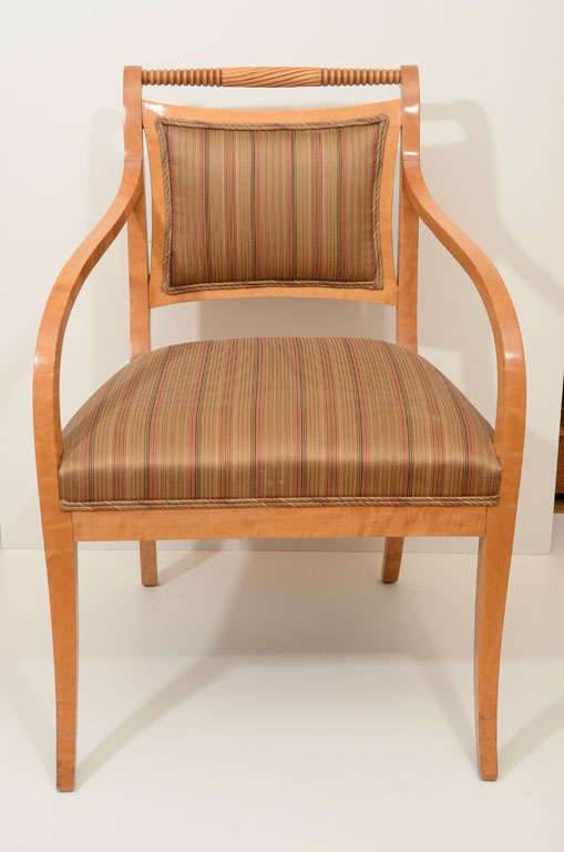 Pair of Empire salon chairs in birch with turned spindle detail. Recently reupholstered in period appropriate silk fabric.