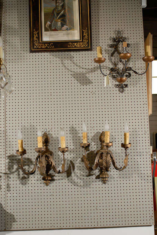 Although the wonderful components of these sconces are old, they were joined together recently. The effect is charming. The soft gold color is very pleasing and the design is most attractive. They have been wired and are ready to install.