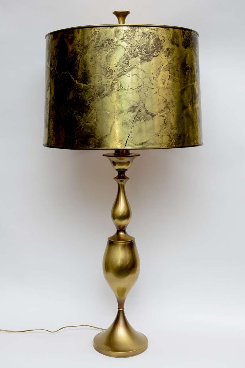 REDUCED FROM $950.
Spectacular in scale and style, this tall Rembrandt brass baluster and urn form table lamp has its original marbleized foil barrel shade and large finial. Wonderfully sculptural, it makes a regal impression and is a room anchor.