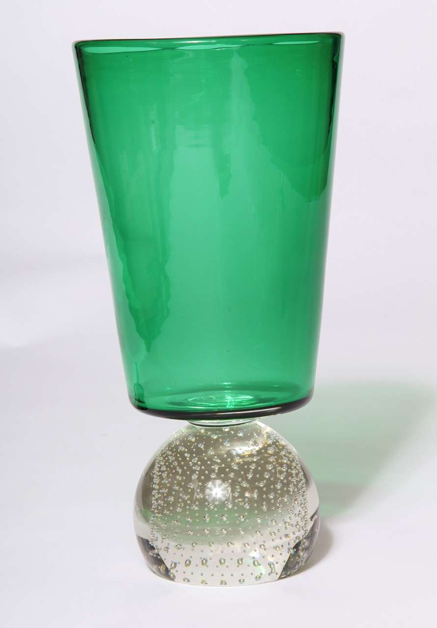 A Carl Erickson emerald green glass vase with a clear bubbled base. Original sticker attached.