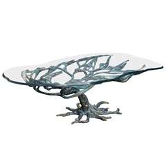 Unusual sculptural cocktail table in bronze