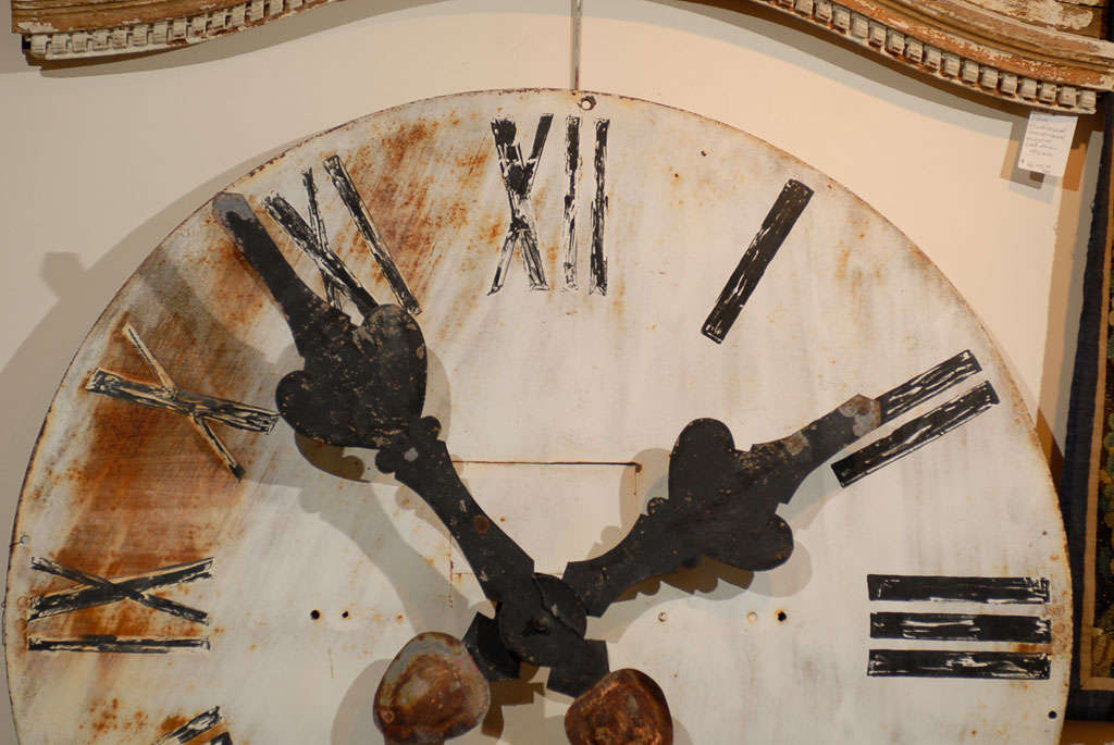 Large French tower clock face in metal with great hands.