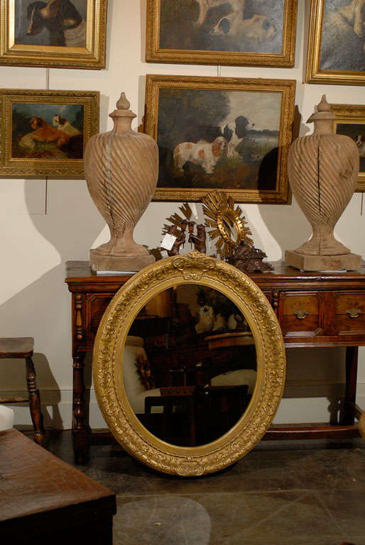 English 1870s Oval Giltwood Carved Mirror with Floral Arabesques and Small Crest For Sale 3