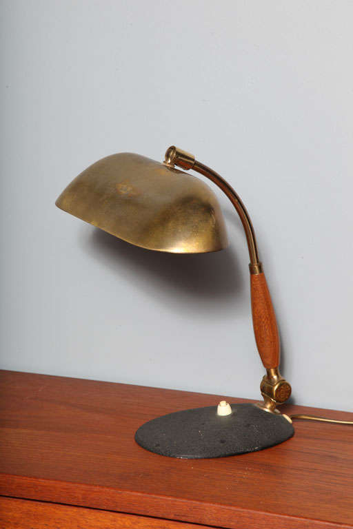 Vintage 1950s Danish Modern Teak & Brass Reading Desk Lamp. Danish Office Furniture.

Danish Modern Reading Lamp with brass shade, cast iron base and teak stem.  Located at ABC Home 888 Broadway 2nd Floor, New York.

Check out our huge selection