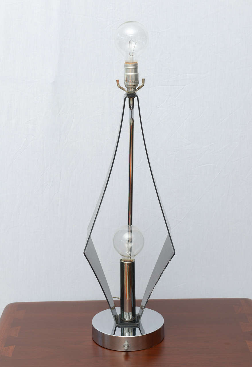 Tall pair of smoked lucite geometric lamps with two bulbs and chrome base.  1972 USA.
