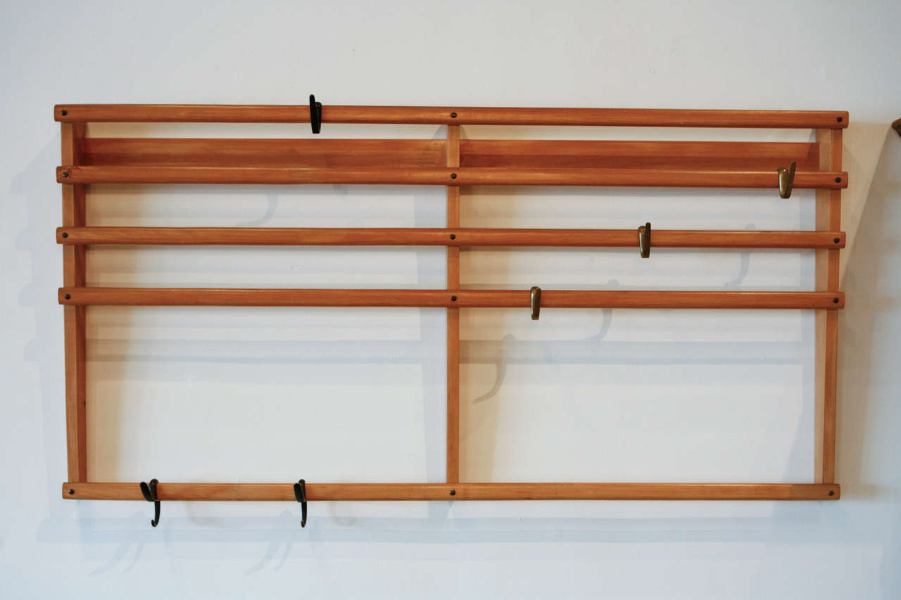 Carl Auböck's wall rack with bronze and brass hooks.