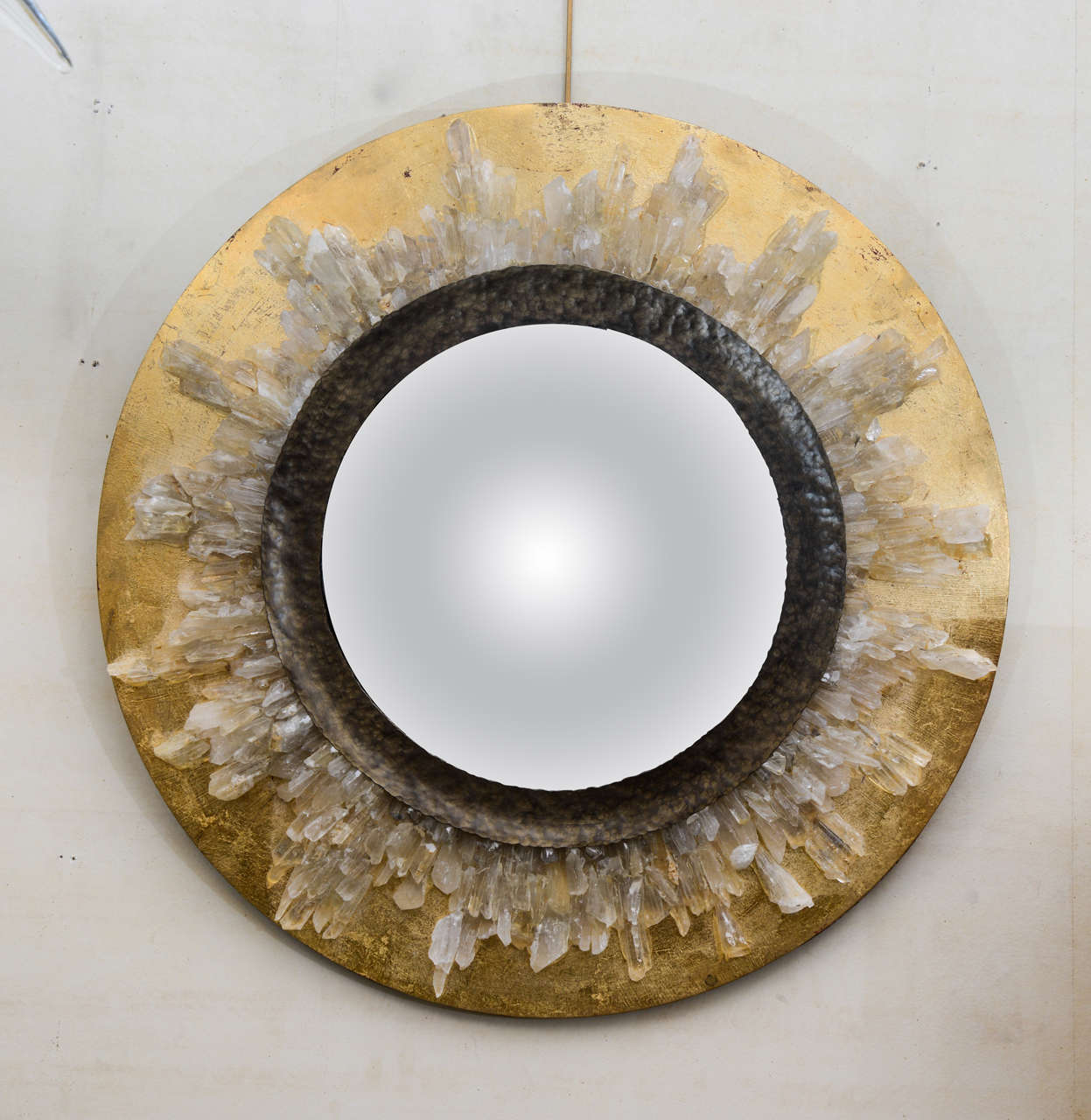 Sunburst mirror with rock crystal designed by Enzo Missoni.