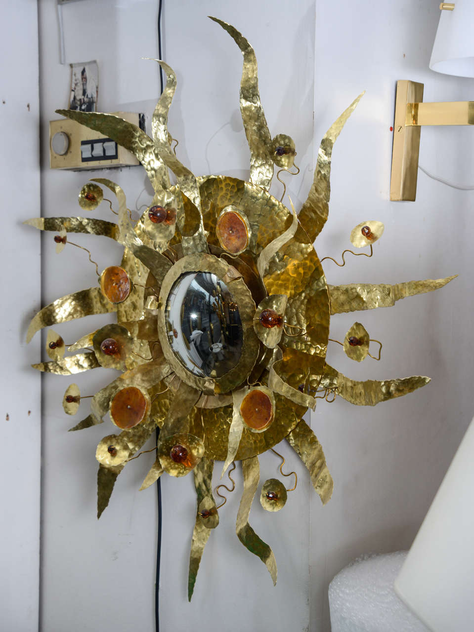 Brass sunburst mirror designed by Enzo Missoni. 
Brass and resin.
