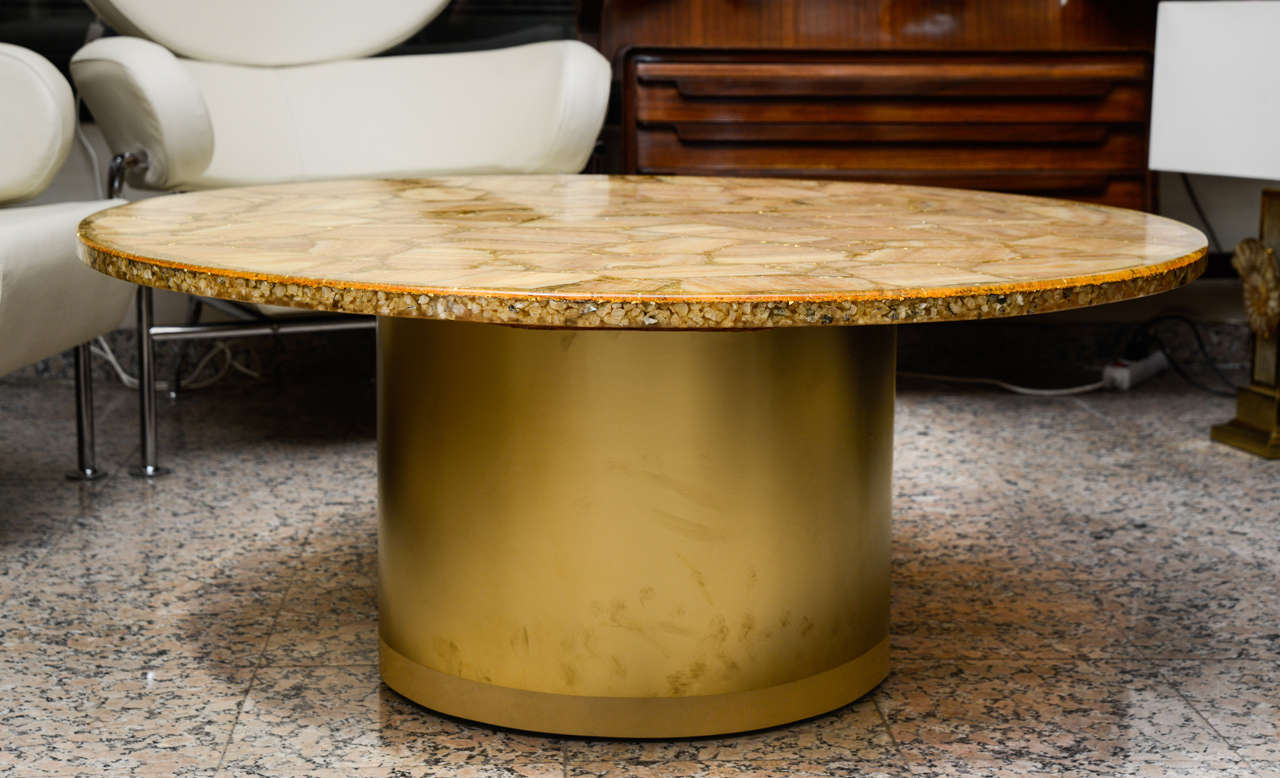 Rare cocktail table with a top with resin inclusion of semi precious stones and gold leaves.