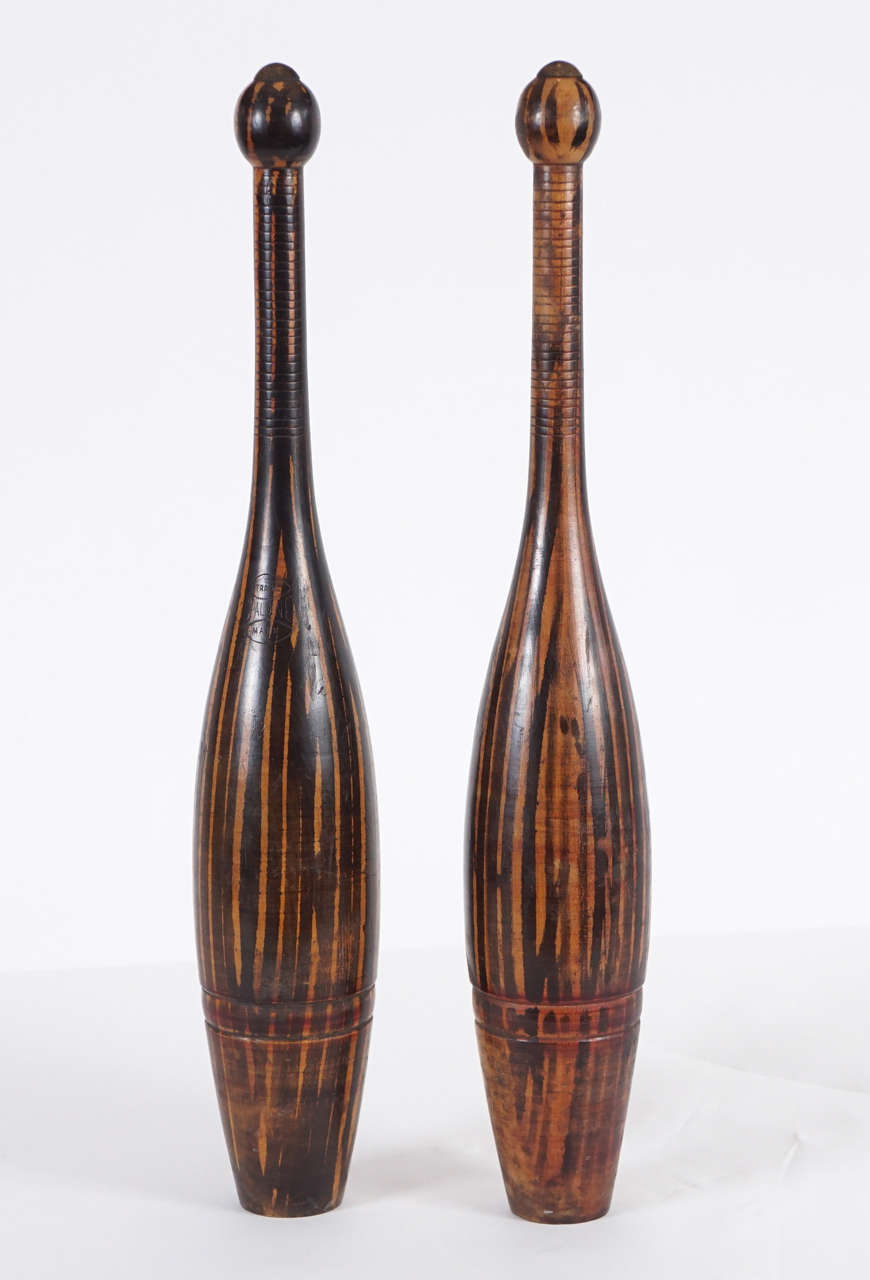 Superb, early pair of bowling pins labeled Spalding. The grain on these is exceptional. They make a fabulous accessory on a table or mantel and work with many decorative styles. Ideal for the novice or collector, these pins add an authentic