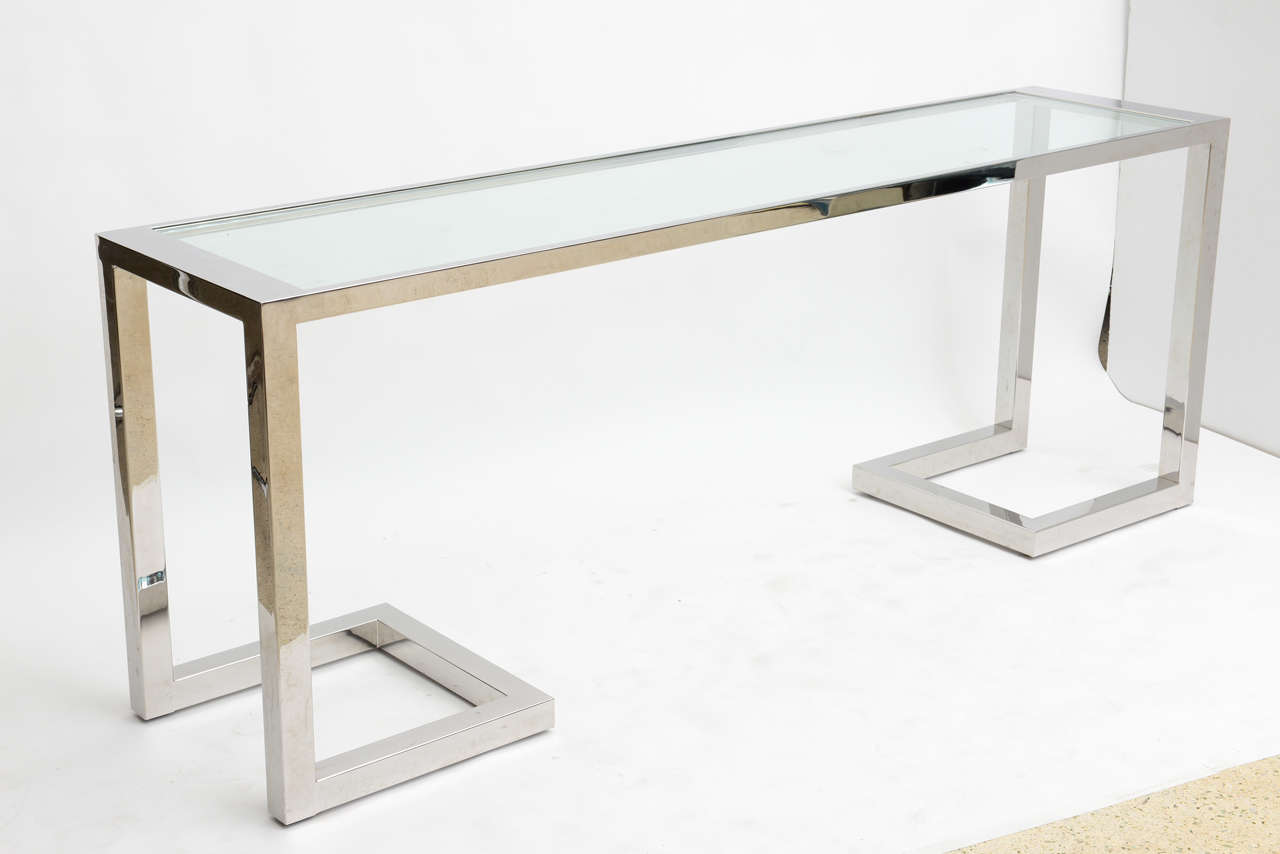 The rectangular chrome frame with inset glass above chrome legs with pierced geometric shape, manufactured by Thayer Coggin in late 1970s-early 1980s, can be sold separately.