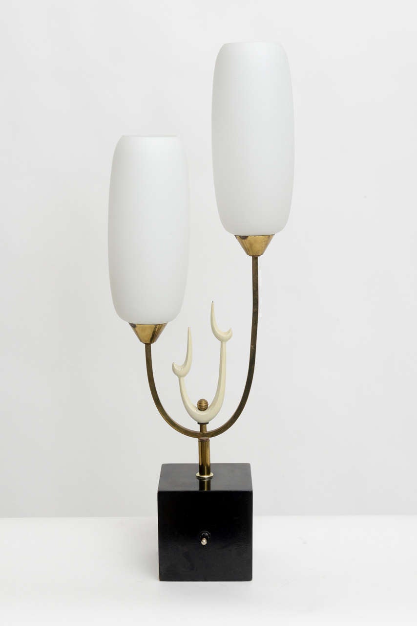 Glass lamp with frosted glass shades on a brass and enameled structure.