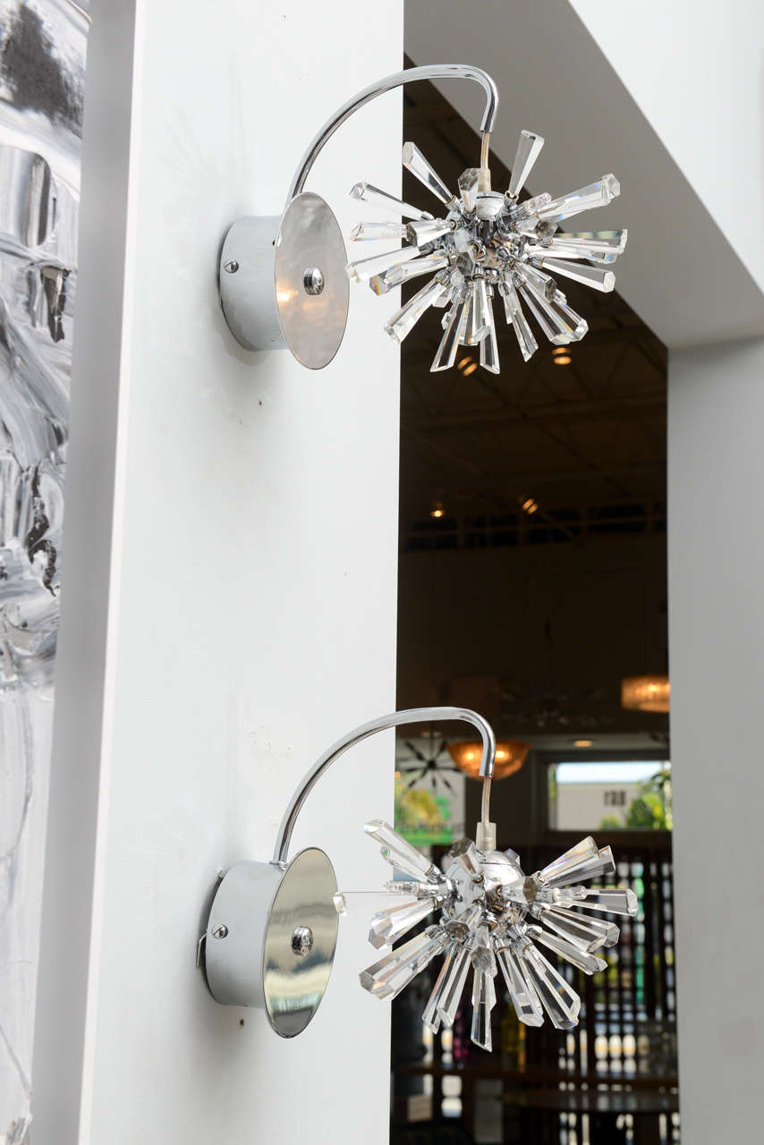 The polished chrome back plate with chrome arms and suspended chrome sphere emanating glass rods in Sputnik form.