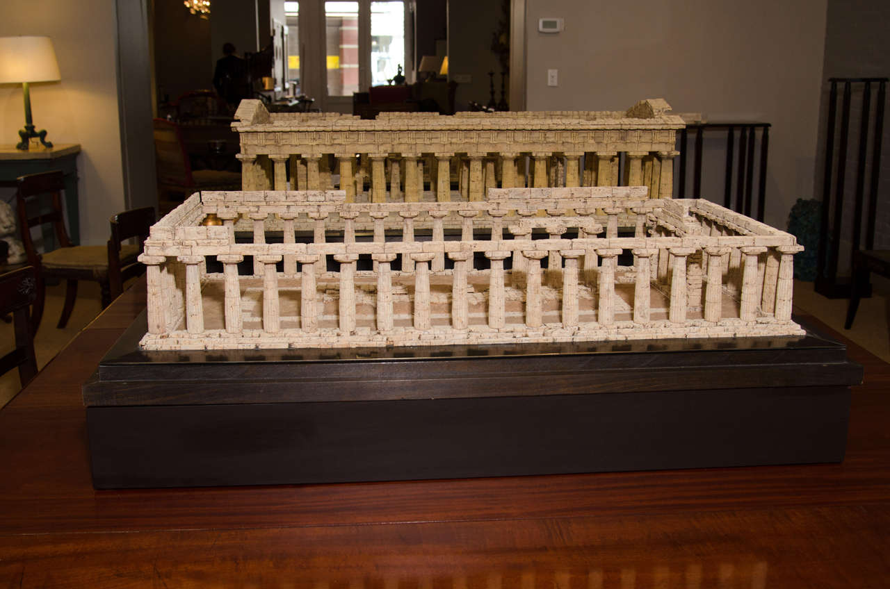 Made by hand by master model maker Dieter Cöllen of Germany. The cork model on a metal base resting on a rectangular stained mahogany platform. The front inscribed 'PAESTUM-HERATEMPEL/ 0-5 m scale', the reverse inscribed 'D.CÖLLEN/ 1999'. Scale