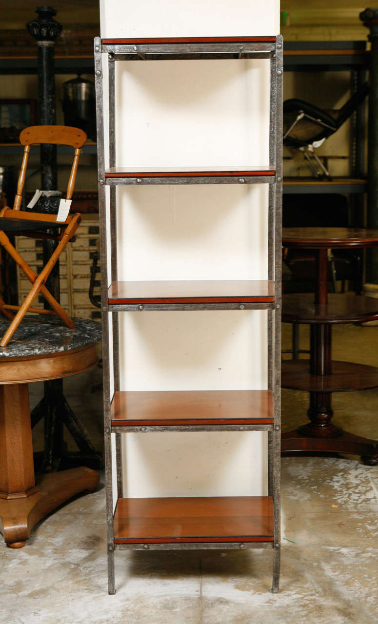 Iron bookcase with wood shelves from England. Great piece as a bookcase or display case.