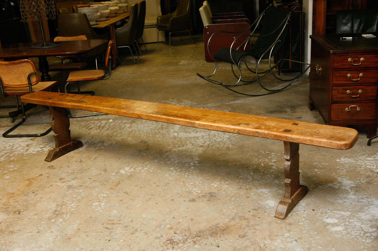 19th century cherrywood bench from France, circa 1860.