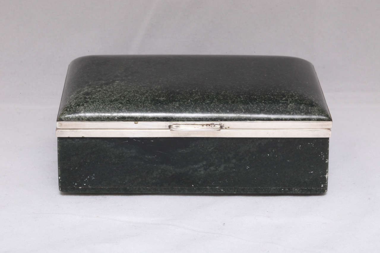 Rare, Art Deco, continental (.800) silver-mounted nephrite jade table box, Austria, circa 1920s. Hinged lid is gracefully curved. Dimensions: 5