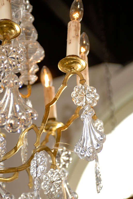 XX secolo Lampadario francese Belle Époque del 1900 a 10 luci in ottone e cristallo con pendeloques in vendita