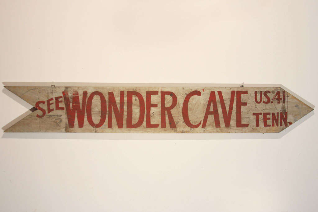 Stylized arrow-shaped road sign for Wondercave, a Tennessee tourist 