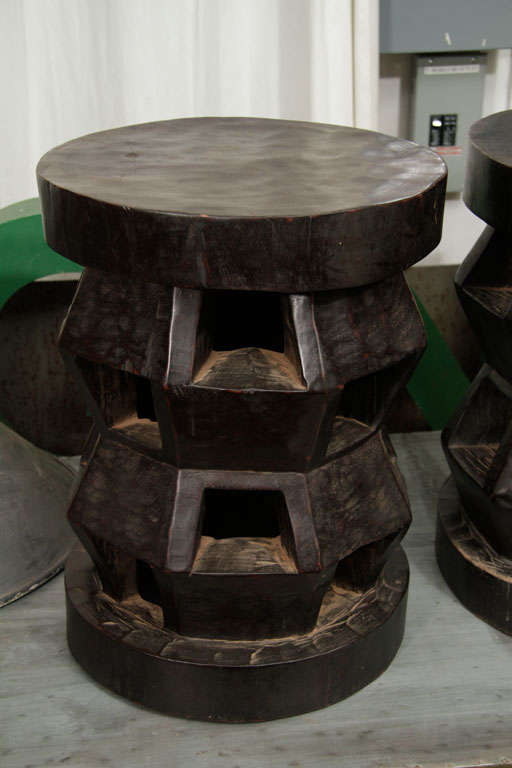 African cubist stools hand carved from single piece of wood, dark mahogany