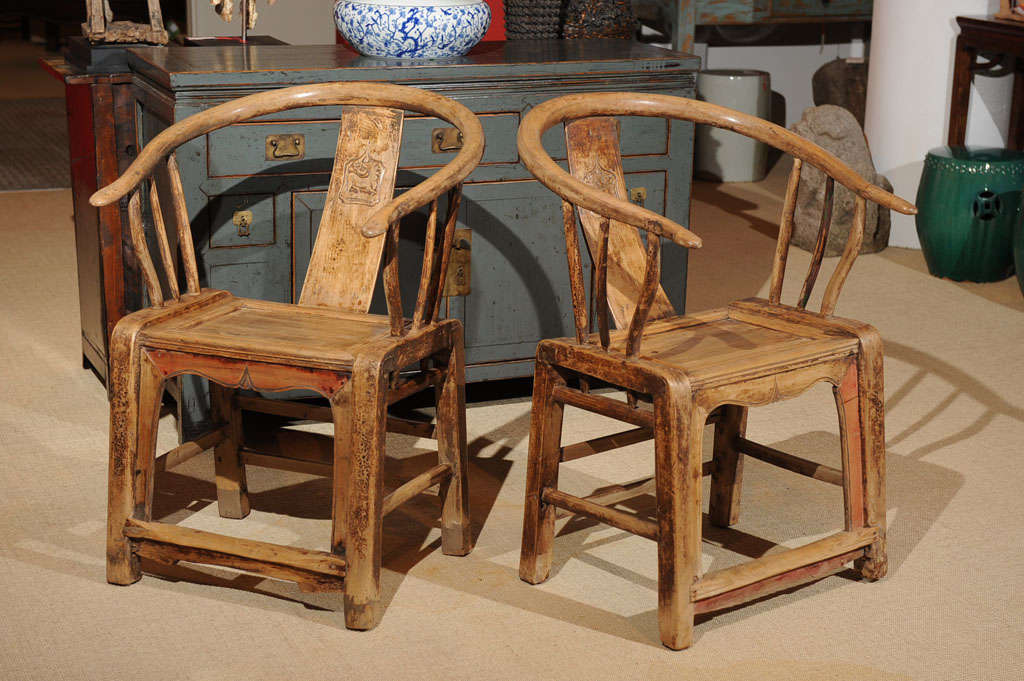 Pair of natural color matching horseshoe arm chairs from Shanxi province.  Original color shows though in certain areas.<br />
19th cent. Priced individually at $ 875 ea. Sale price $ 450 ea.