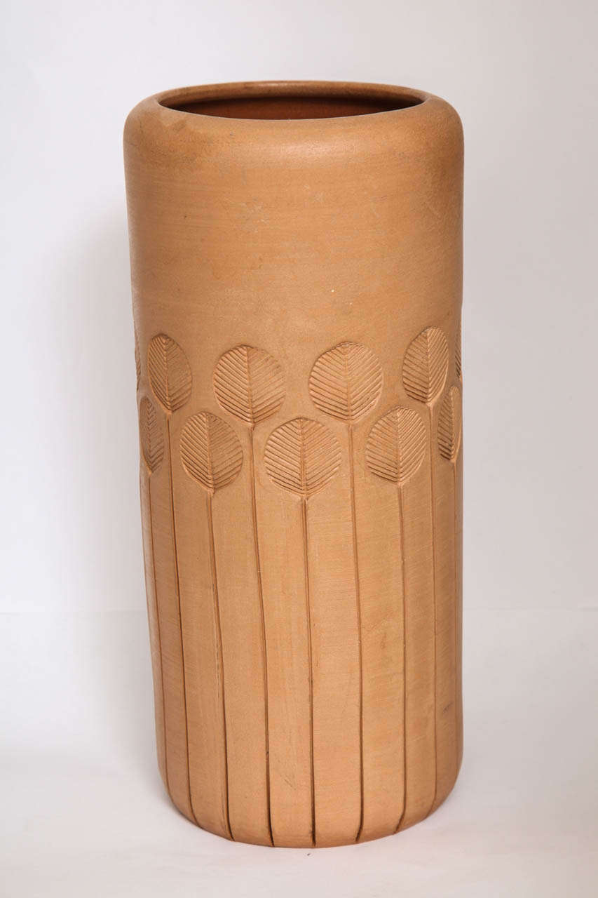 Store closing-- last day is 7/31. Offers welcome! Unglazed terracotta vase with impressed leaf motif. Imported by Raymor and marked with sticker to base.