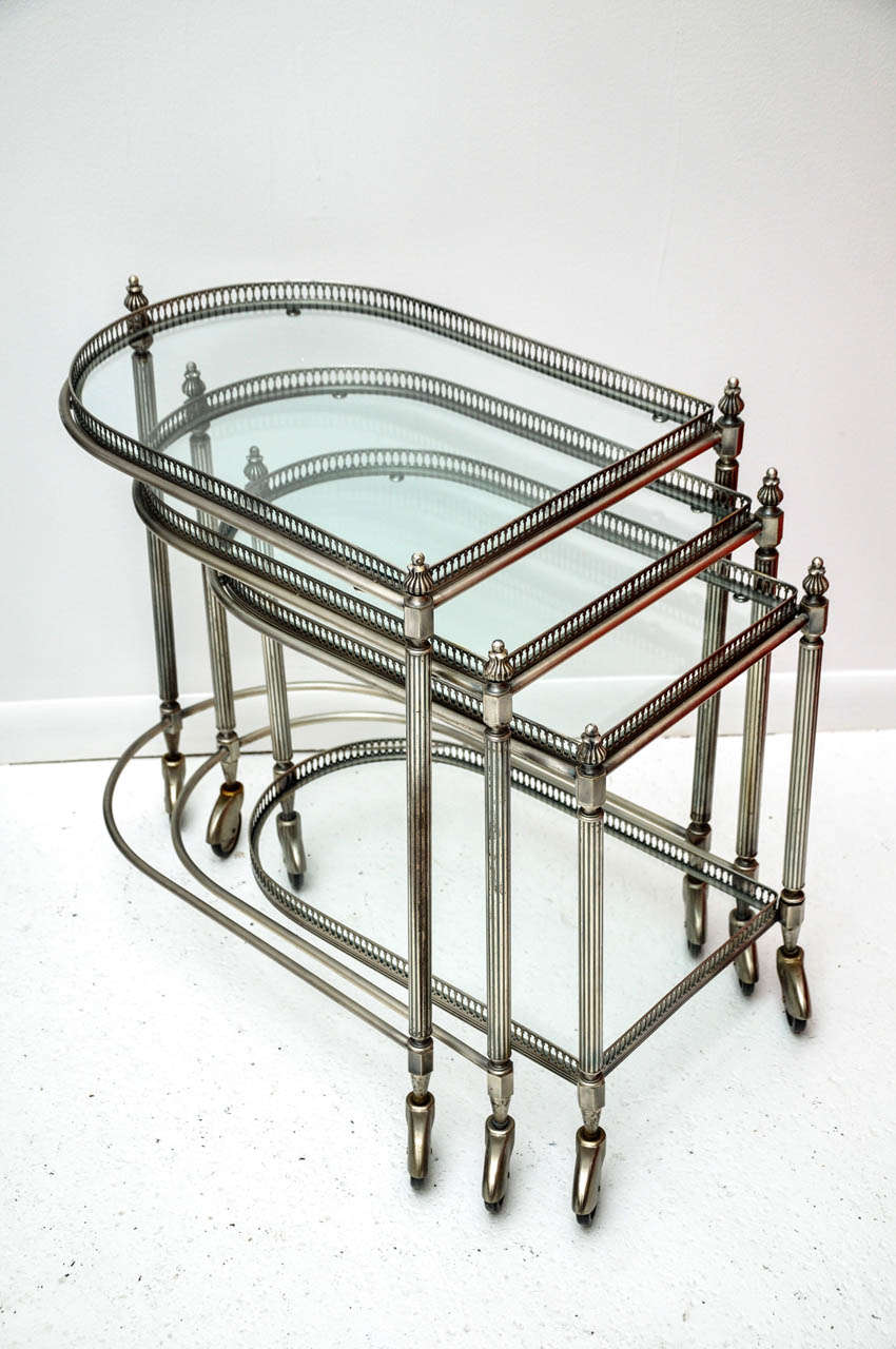 Set of three antique metal serving carts. Measures: Large: 15