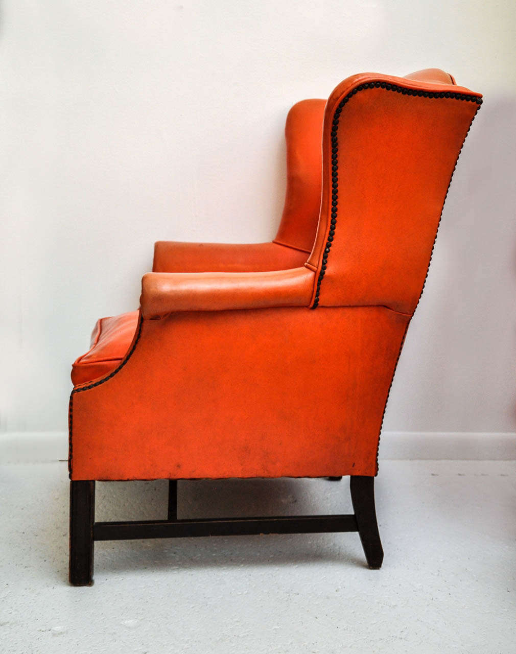 orange wingback chair