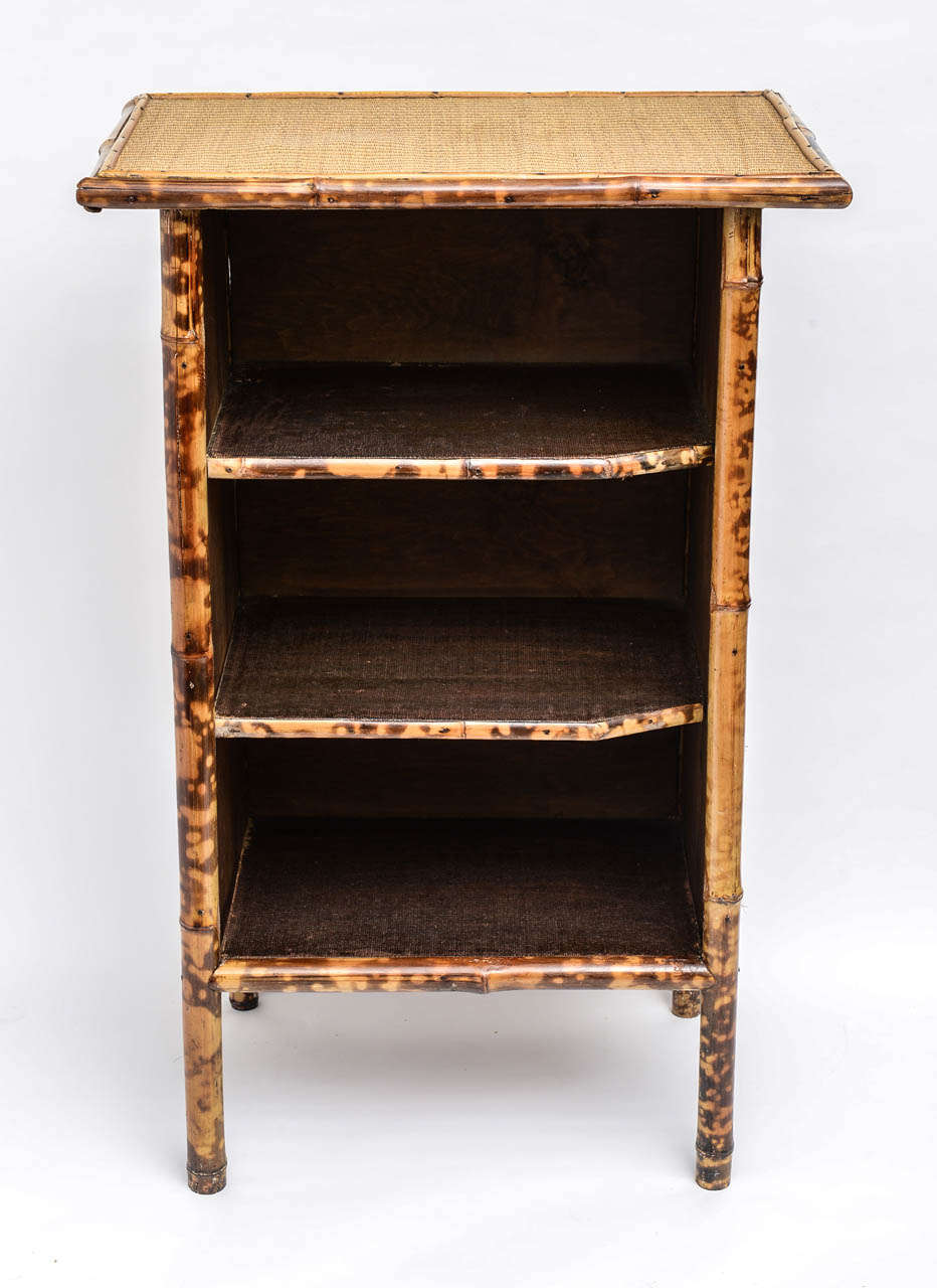 A very charming turn of the century English rattan and bamboo bookcase.