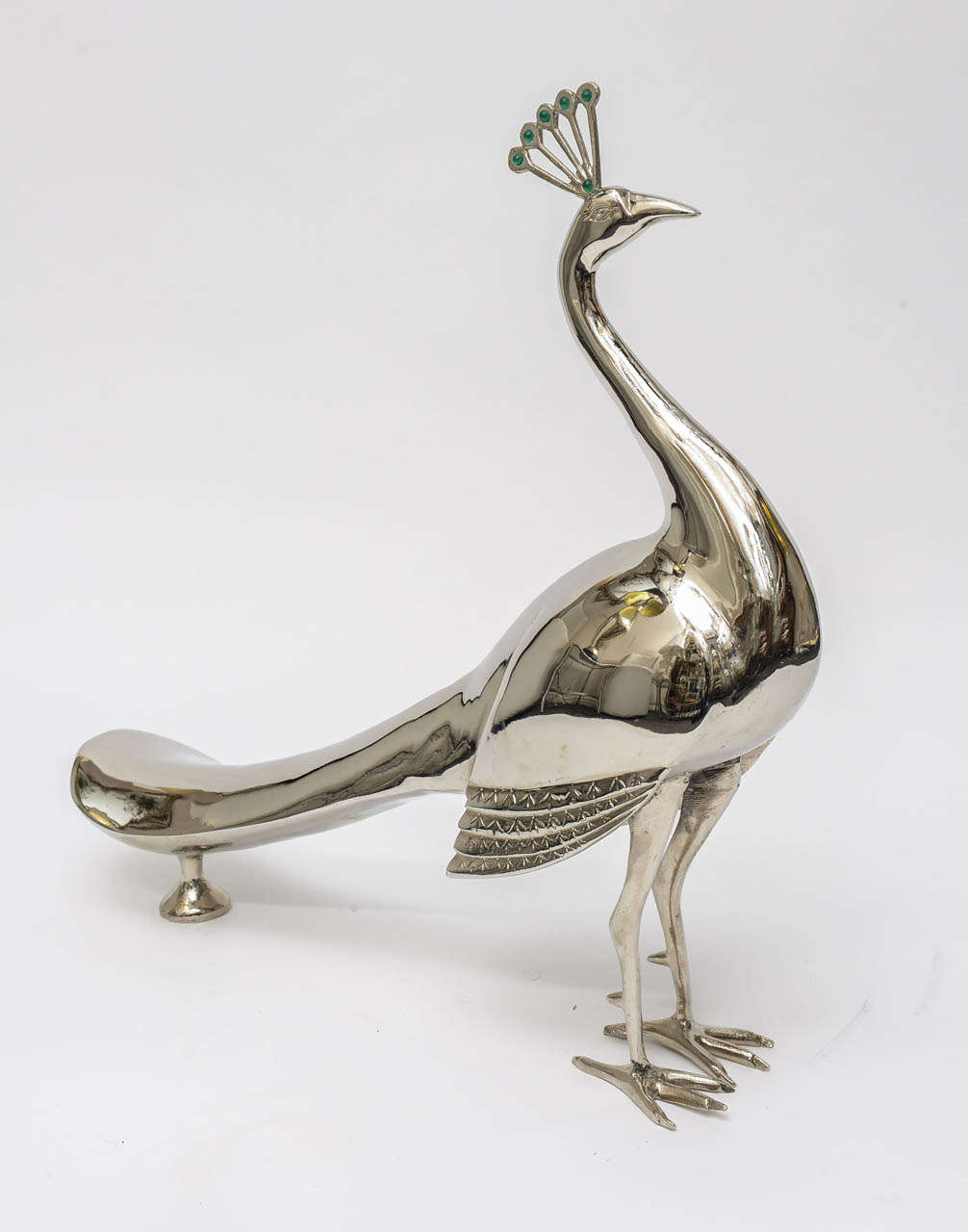Elegant Mid-Century large Silver on Brass peacok.