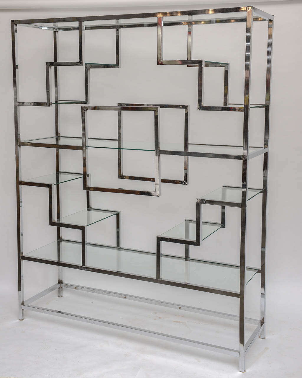 Substantial multi-leveled vintage chrome étagère. Could be used as a chic room divider or against a wall. 14 shelves.