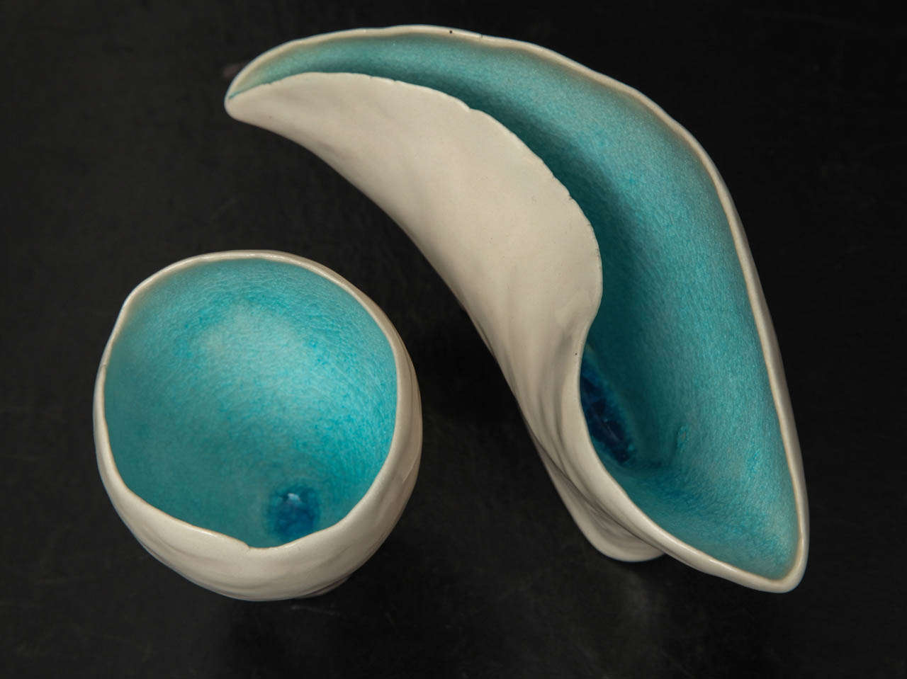 Tall Wisps, Aqua, Duo
Pair of hand-built porcelain vessels with aqua glaze interior. 
Made by Stephanie Chiacos expressly for Liz O'Brien.

Smallest: 3 3/4”H x 3”Dia  
Largest: 4 1/8”H x 7”W x 2 1/2”D