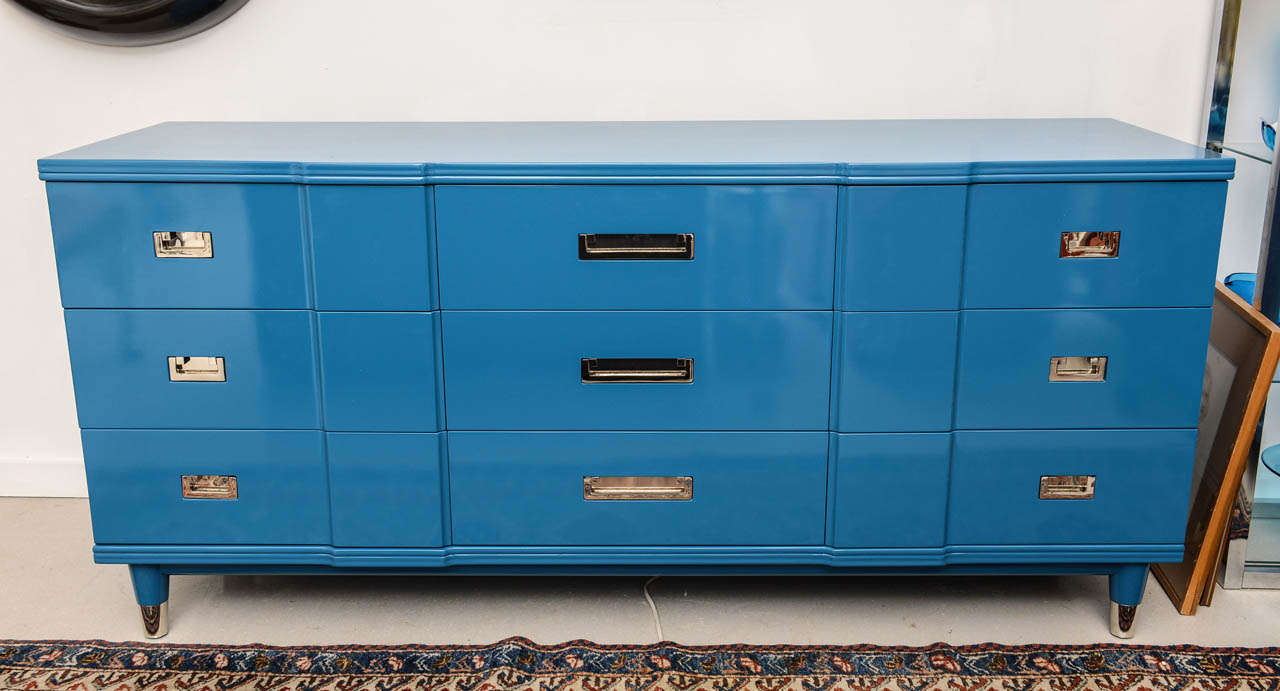 Ocean blue lacquered John Widdicomb chest  with nine drawers featuring chrome geometric handles. 

Smaller matching ocean blue lacquered Widdicomb dresser is also available