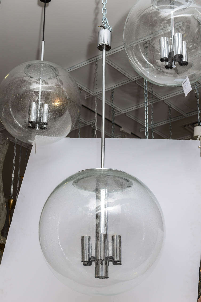 Large circular glass and chrome pendant light stamped 