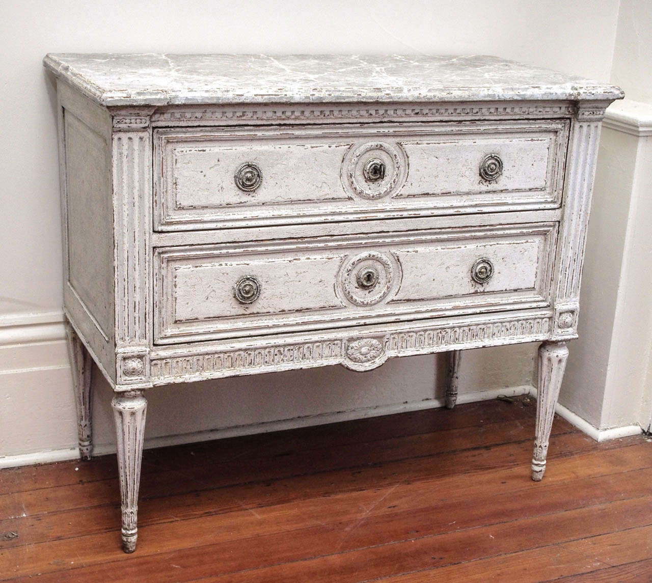 Pair of 19th century painted commodes . Louis XVI style with a marble faux finish top and 2 drawers.
