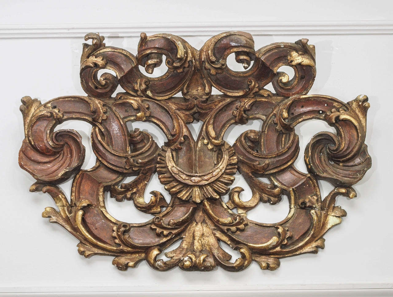 18th century carved wood molding with gilt and paint in an acanthus motif