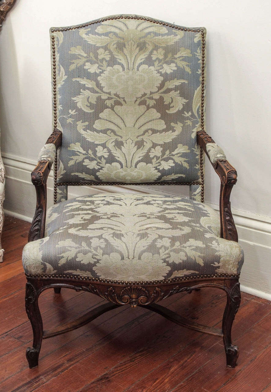 Pair of 19th century  walnut Regence style carved armchairs with stretcher