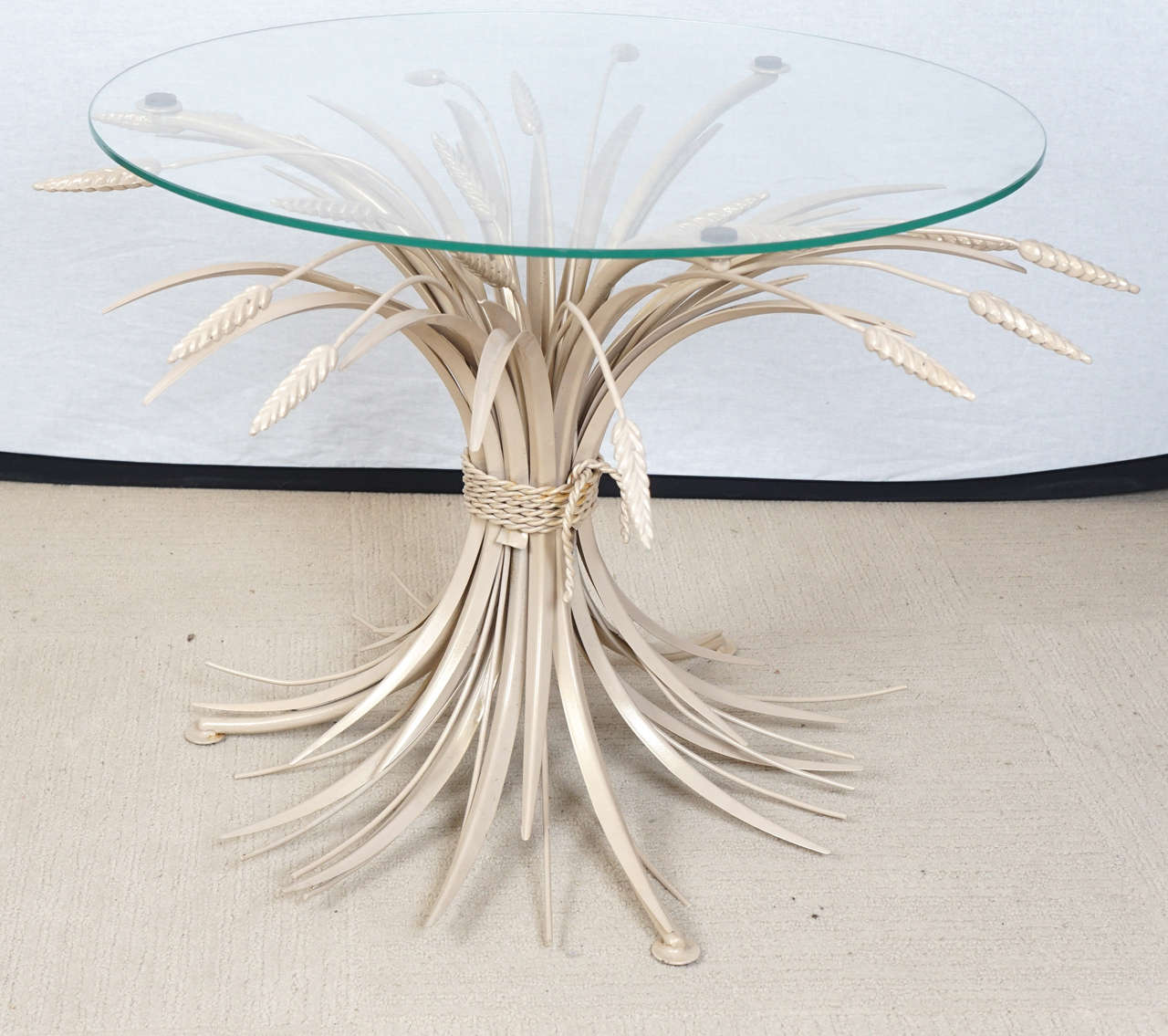 A Sheaf of Wheat style coffee table, most commonly labeled for Coco Chanel and hollywood regency from around 1962. This table is painted with a muted pale tone.