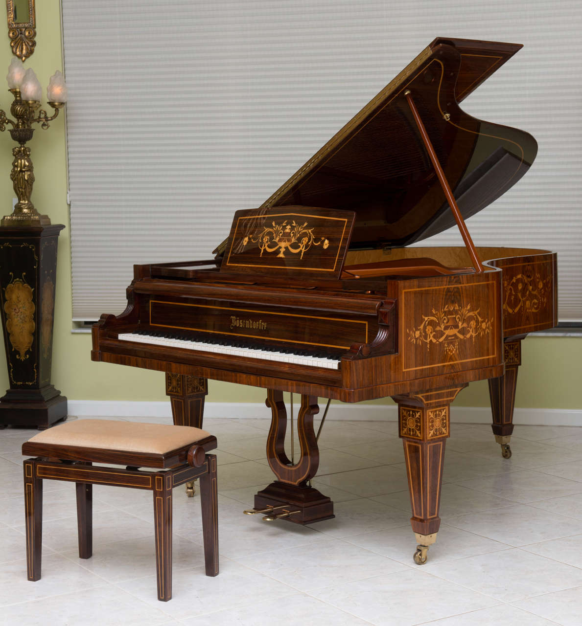 Provenance: The Vienna Opera House.
The exterior case in palisander, boxwood, lemonwood, satinwood, Amboyna, and birch including the piano lid, bridge and lyre.
The interior case in custom sapelli veneer.
The entire piano underwent a meticulous