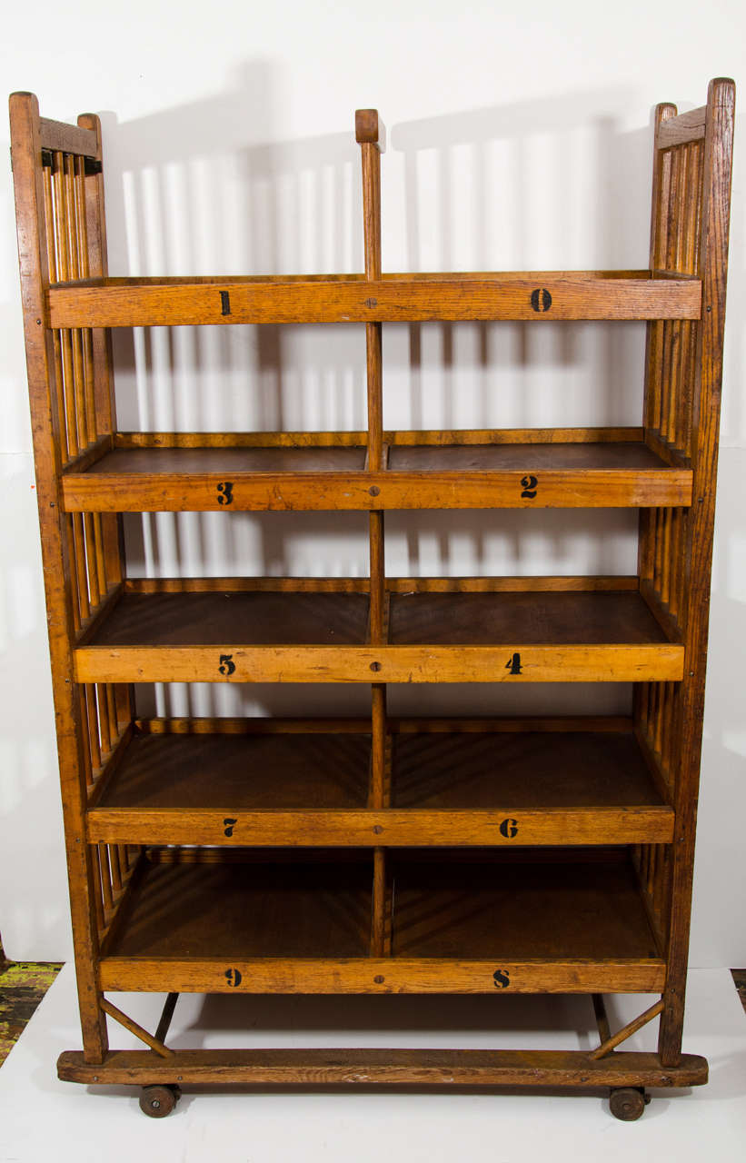 Manufactured by the Champlin Box Company in Hartford Connecticut, from the Beaver Kill region.  Numbered shelves, on iron casters 1940's, USA.