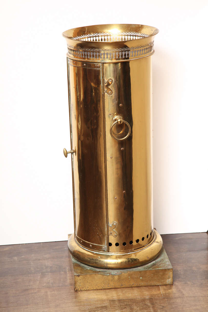 Made in Paris in the 1850s by Chevalier of Montmartre, this brass chauffe-plat in the form of a column kept food hot for an officer when on a military campaign. Burning coals at the bottom heated the dishes that were placed on shelves above.  Two